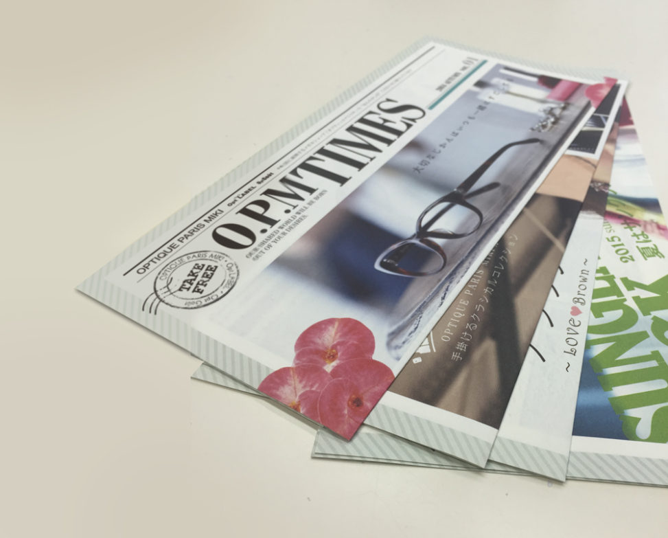 メガネ販売チェーン店様の季刊紙の企画デザイン